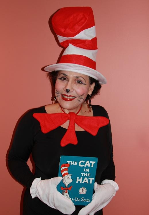 Virtual Cat in the Hat Storyteller show features a professinal actress, singer, chidlren's entertainer. Reads Cat in Hat story with Cat in the Hat hand puppet with characters, includes Cat in the Hat music, singing, dancing, unique birthday song and more. Hire Cat in the Hat outdoor online Singing Telegram for all ages, any occasion.