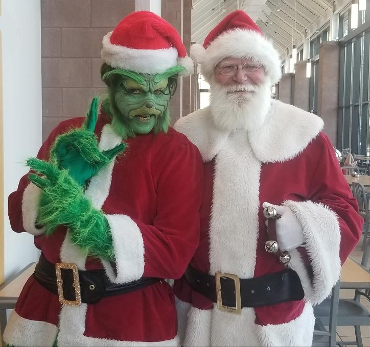 Professiona film and stage actor formerly of Broadway poses as The Grinch created by prothetics and theater make up, and real beard Santa Claus for Xmas parties and corporate events in New Jersey.