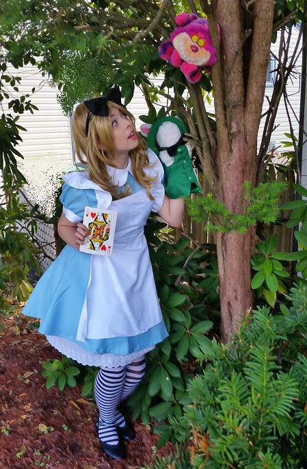 Jennifer- professional musical theater stage actress and trained singer poses as Alice from WonderLand, Alice Wonderland Adventure includes purple cat and white rabbit puppets, magic show, down the rabbit hole treasure hunt with souvenirs, make-a-wish magical hearts, stickers, Alice coloring pages, balloon art, and optional tattoos and face painting